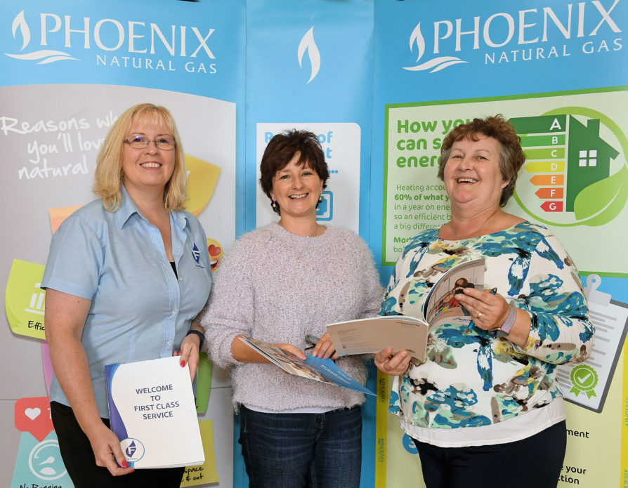Local resident Gillian McClean (centre) gets ‘switched on’ to natural gas with help from Pippa Mitchell from Fusion Heating and Ray McClay from Worcester Bosch