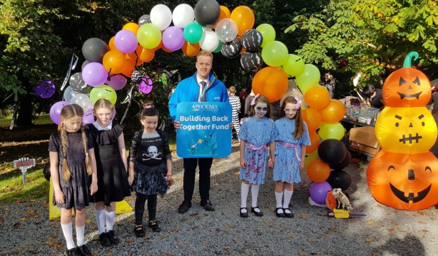 Jonathan King, Phoenix Energy Energy Advisor, with some of the pupils from St Brigid’s Primary School, Downpatrick at the school’s spooky trail which was supported by the Phoenix Energy Building Back Together Fund.