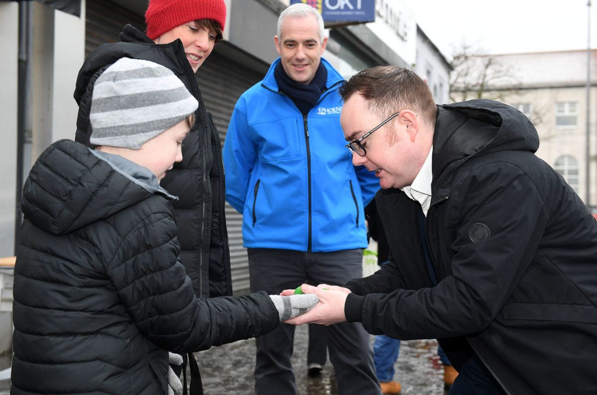 Pamela Drennan and son Thomas Drennan are dazzled by magician Caolan McBride